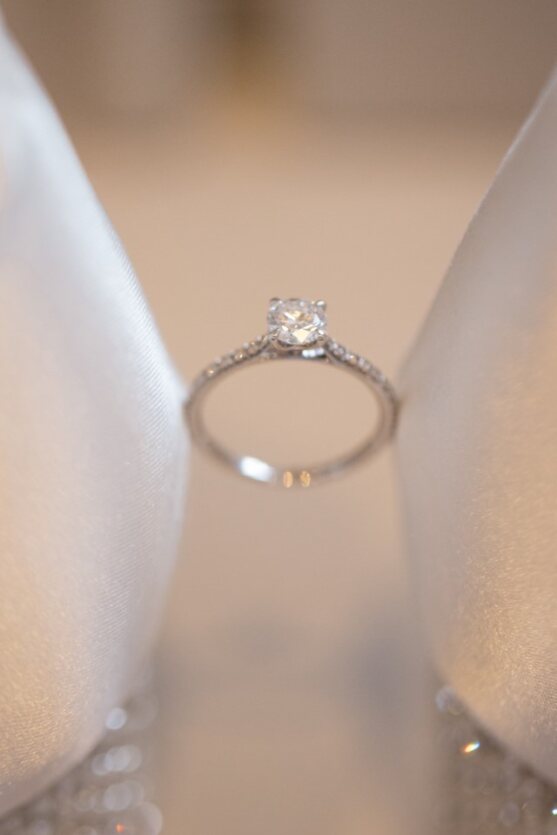 A close up picture of wedding ring with diamonds