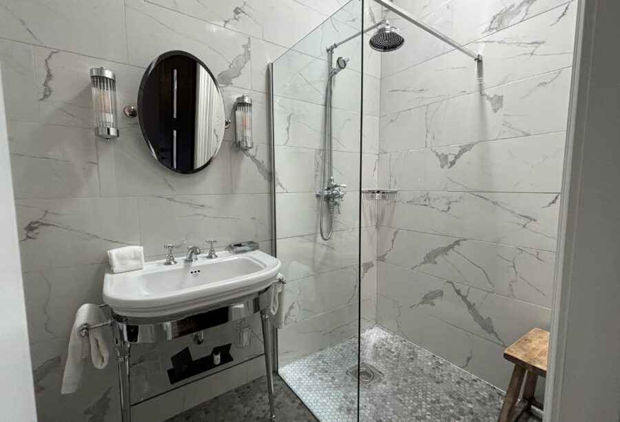 A close look at one of the bedroom bathrooms at Manor House Lindley with white tiles