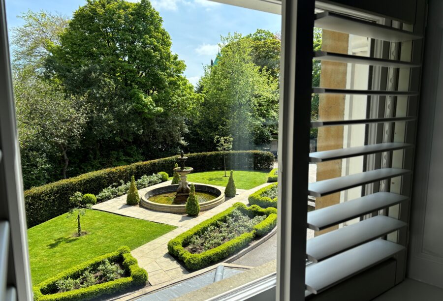 A view from the bedroom window looking out onto the front gardens at Manor House Lindley.