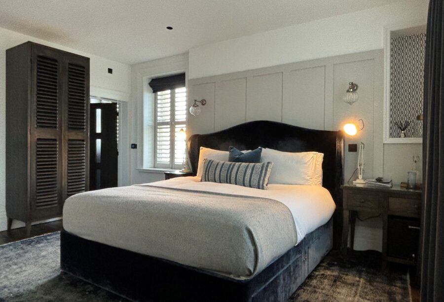 A view of one of the bedrooms at Manor House Lindley, featuring a king-size bed.