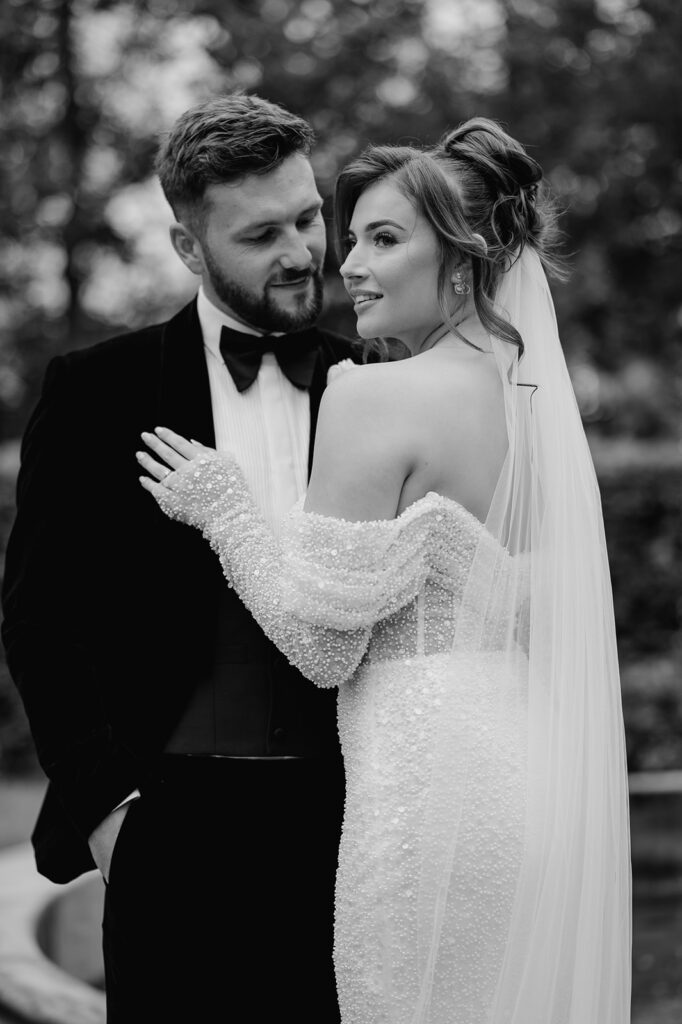 Black and white picture of Bride and Groom outside at Manor House Lindley