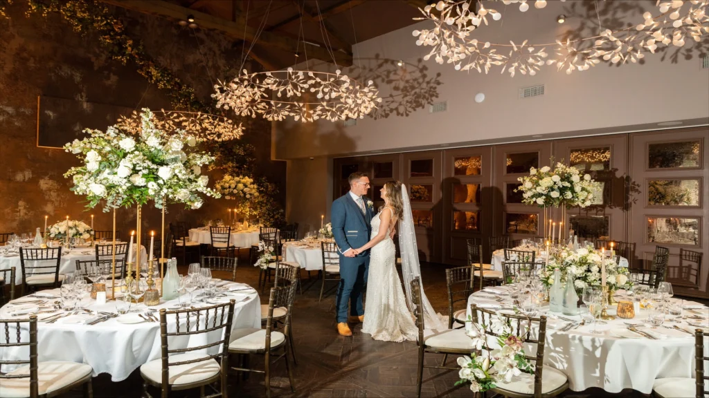 Bride and groom inside the wedding venue at Manor House Lindley