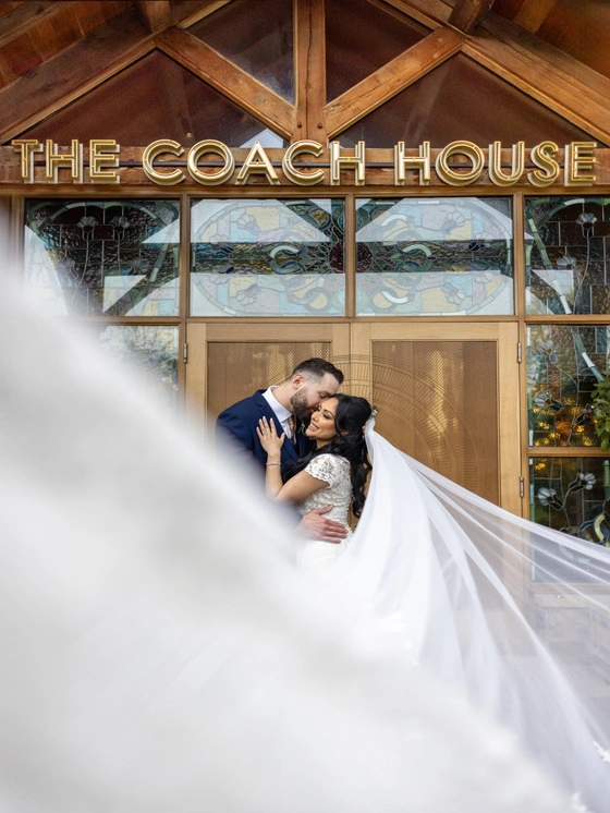 Bride and groom outside the wedding venue, The Coach House