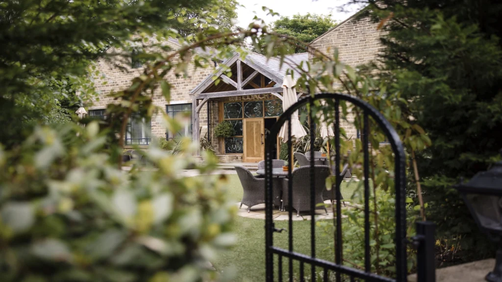 A view of the wedding venue, The Coach House, outside at Manor House Lindley