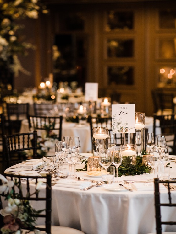 A view of he wedding venue inside Manor House Lindley with tables decorated for wedding