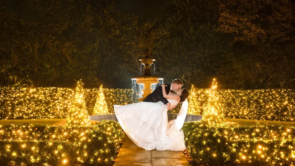 Bride Rosanna and Groom Iian kissing in the grounds at Manor House Lindley