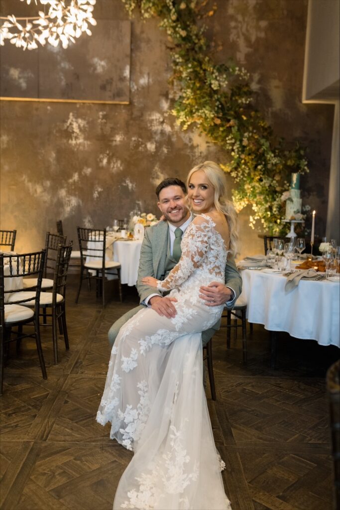 Bride and groom sitting inside the wedding venue Manor House Lindley