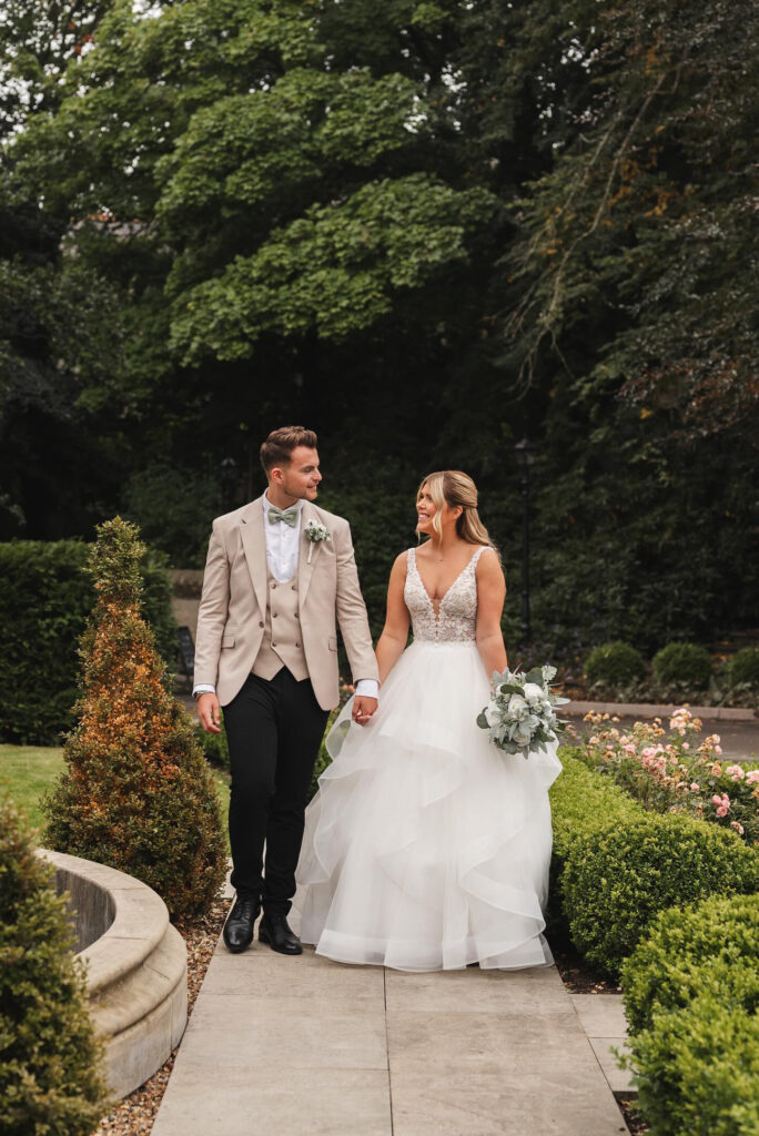 Bride and groom outside the ground in Manor House Lindley